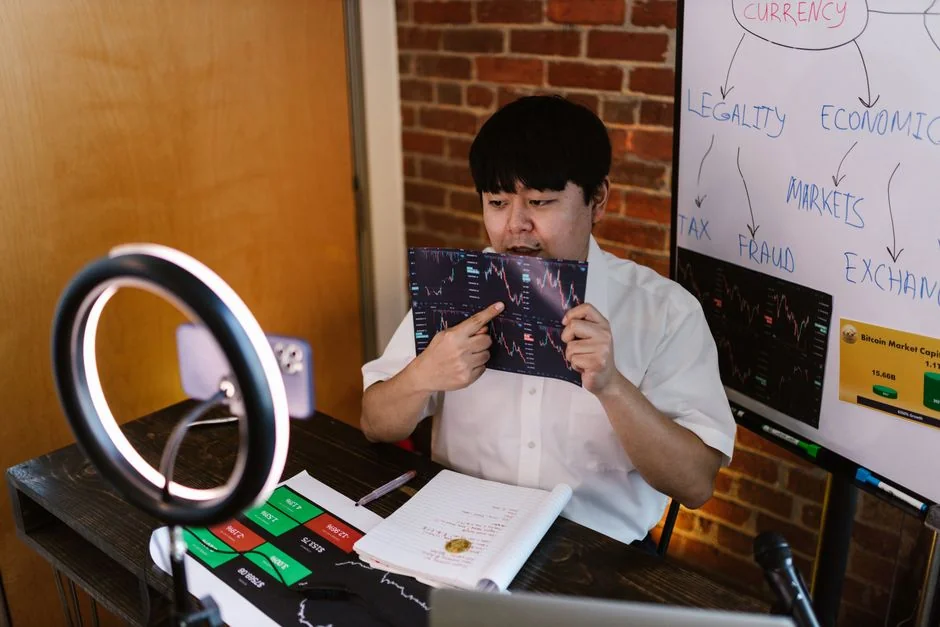 A person is holding a smartphone and browsing the SumUp Instagram profile.